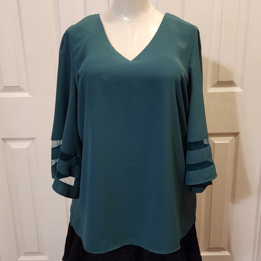Lookbook V neck top with 3/4 bell sleeves with mesh insert in dark green/emerald